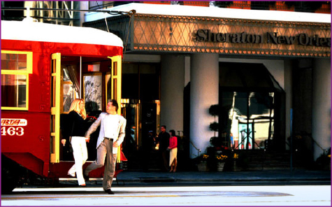 Couple stepping off trolley