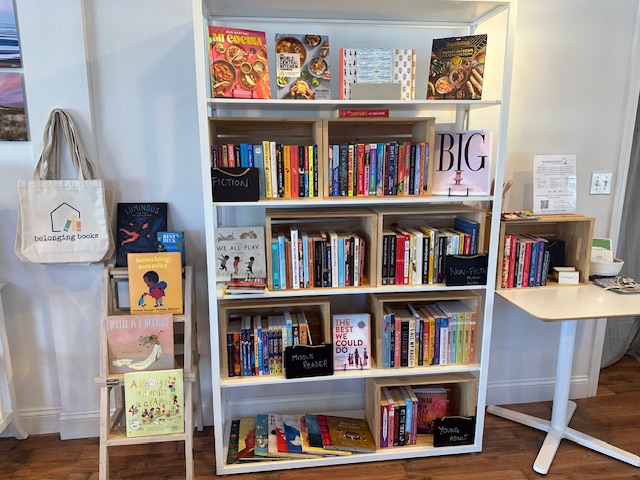 a white bookshelf, full of books